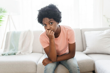 Young woman in stress on the living room