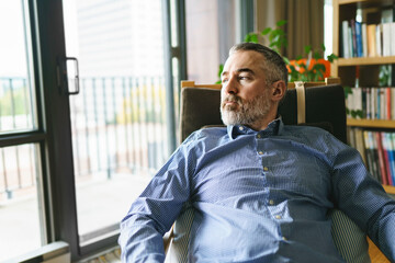 nice Joyful mature man at home appartement with grey beard