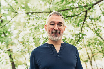 Portrait of a mature man in an urban park