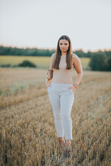 Poster - Vertical shot of a white Caucasian woman posing for a picture in the field