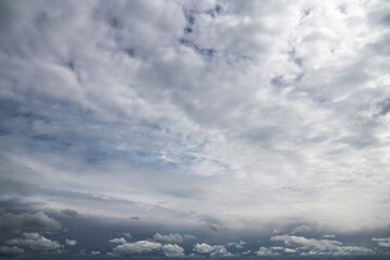 Wall Mural - replacement sky background or backdrop with beautiful white cumulus and altostratus clouds in a dram