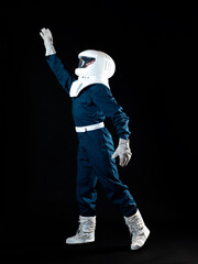 Wall Mural - An astronaut in weightlessness reaches up with his hand.