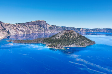 Wall Mural - This specifiic Crater Lake blue. Wizard island in the blue water of the Crater Lake.