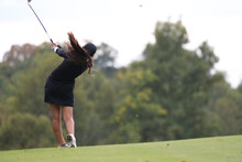 A High School Girls Hits A Golf Shot During A Tournament.