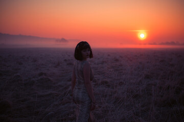 Desert in Egypt. Girl portrait in egypt style clothes. Sunset. Close-up