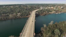 Aerial: City Of Folsom And Bridge Crossing Lake Natoma, California, USA