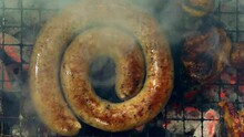 South African Style Sausage Coil Grilling On A Barbecue, Top View