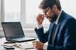 © SHOTPRIME STUDIO - bearded man in the office at the desk career anger professional