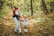 © Petro - Mother with her little son and daughter in an autumn park