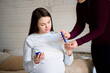 Pregnant woman checks the blood sugar, diabetes test.