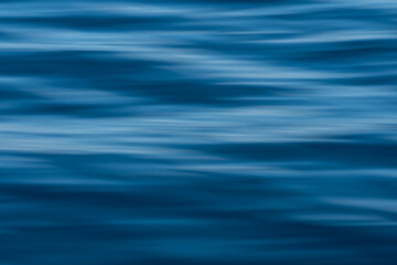 Dark blue hazy ocean ripples