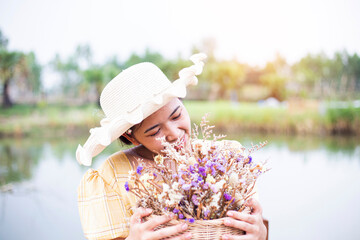 Beauty young woman with flowers and make up close , real spring girl