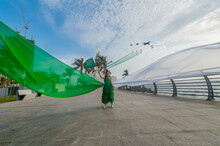 A Girl Carrying The Saudi Flag On The Saudi National Day And The Air Show