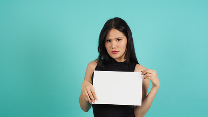 Wall Mural - Blank empty paper in asian woman's hand on mint green or Tiffany Blue background.