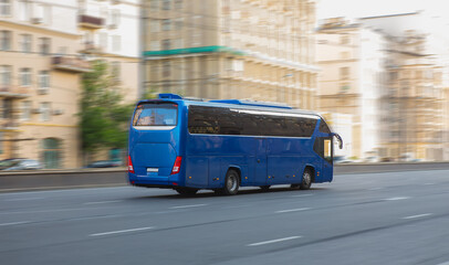 Wall Mural - tourist bus moves along a city