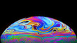 Colorful close-up of soap bubble on black background, iridescence phenomenon, looks like rising planet