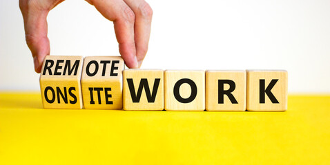 Remote or onsite work symbol. Businessman turns cubes and changes words 'onsite work' to 'remote work'. Beautiful white background. Business, remote or onsite working concept, copy space.