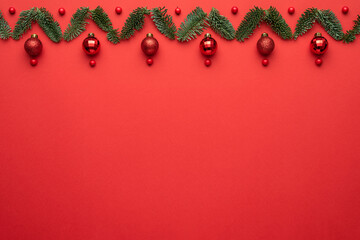 Wall Mural - Holiday card with Christmas border ornament on a red background