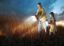 Father And Daugther With Glowing Bibles