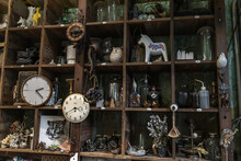 Bangkok, Thailand - Jun 26, 2020 : Wall Clocks And Collectibles On Handmade Wooden Rustic Wall Shelf In Living Room Vintage Style. Selective Focus.