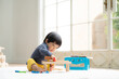Cute Asian (Japanese) baby playing with educational toys