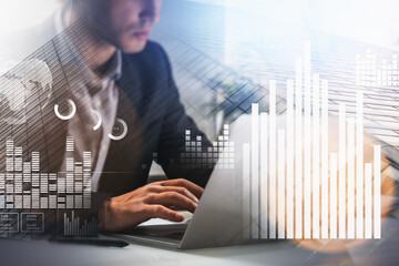 Aufkleber - concentrated young business man or stock trader analyzing stock graph chart using laptop to buy or s