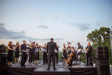 Musical ensemble playing classic instrumental music on the street