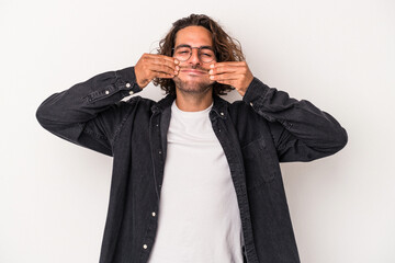 Young caucasian man isolated on white background doubting between two options.