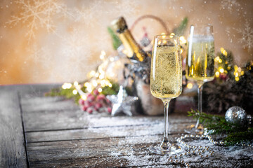 Wall Mural - Champagne glasses and christmas decor on sparkling holiday background