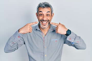 Sticker - Handsome middle age man with grey hair pointing mouth with fingers celebrating crazy and amazed for success with open eyes screaming excited.