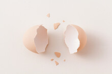 Top View Broken Egg Shell On White Background.