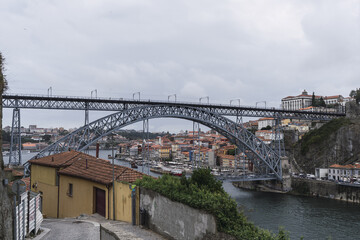 Poster - Scenic view of Luis I Bridge in Porto, Portugal on a cloudy sky background