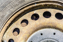 Old Rusty Car Wheel Rim Closeup
