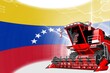 Agriculture innovation concept, red advanced rural combine harvester on Venezuela flag - digital industrial 3D illustration