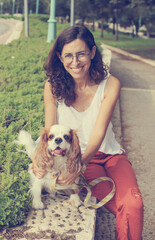 Wall Mural - Woman 50 years old with walking the dog in the park