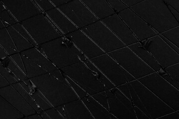 Wall Mural - Black old paper texture close up. Worn cracked grunge cardboard