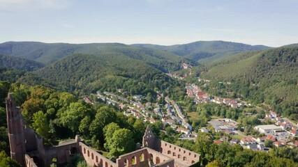 Wall Mural - Flying backwards above the monastery ruin 'Kloster Limburg' on a sunny day in Bad Dürkheim, Germany