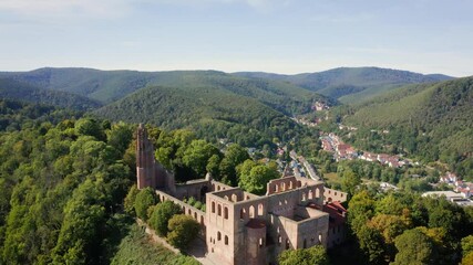 Wall Mural - Slow flight above the monastery ruin 'Kloster Limburg' on a sunny day in Bad Dürkheim, Germany. Aerial view