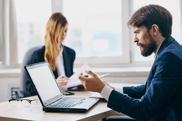 Sticker - business man and woman in the office in front of a laptop career network officials