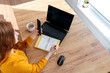 © Дарья Колпакова - Defocus. Young business woman is using the computer and talking on the phone.