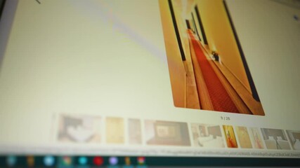 Monitor screen view with website travel agency where many deals are showed. Page scrolling trough destinations around world. Booking hotel room for summer holiday. Close up. Slow motion ready 59.94fps