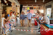 © luckybusiness - teambuilding game - happy colleagues playing game and having fun in the modern office