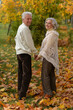 © aletia2011 - Portrait of happy mature couple posing outdoors in autumn park