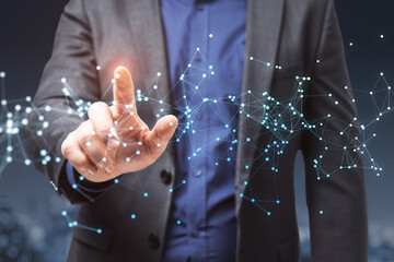 Aufkleber - Close up of businessperson hand pointing at glowing polygonal mesh on blurry night city background. Technology, network and connections concept. Double exposure.