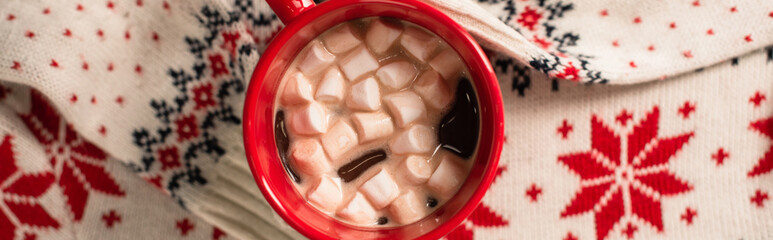 Canvas Print - top view of cocoa with marshmallows on knitted sweater, banner