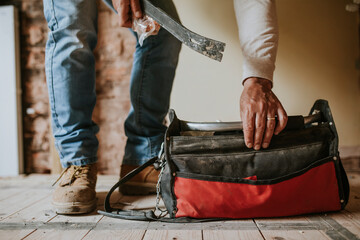 Wall Mural - Home technician take out equipment from his bag