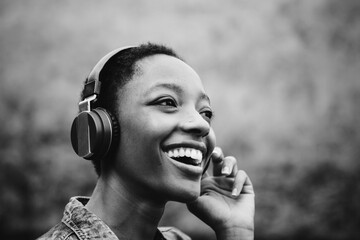 Wall Mural - Woman listening to music in nature