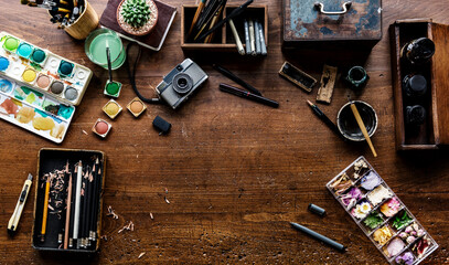 Poster - Aerial view of artistic euqipments painting tools on wooden table