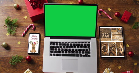 Poster - Laptop with green screen on screen, with smartphone,tablet and christmas decorations