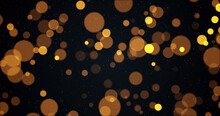 Image Of Warm Glowing Yellow And Orange Spots On Black Background